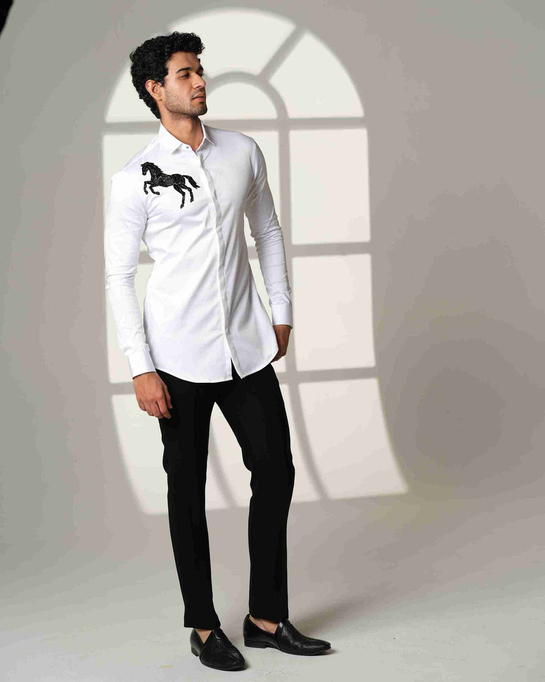 White Shirt with Black Horse on Right shoulder
