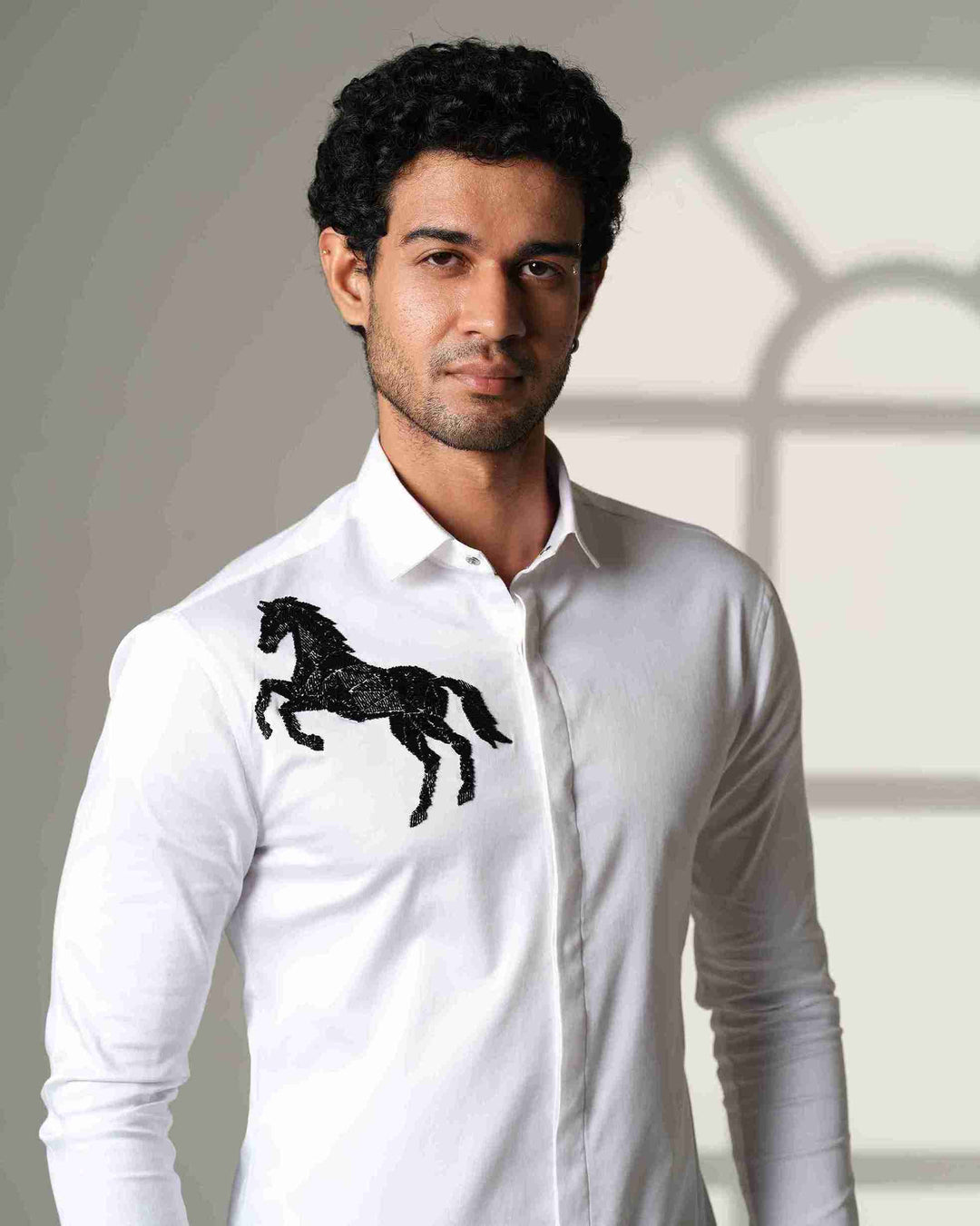 White Shirt with Black Horse on Right shoulder