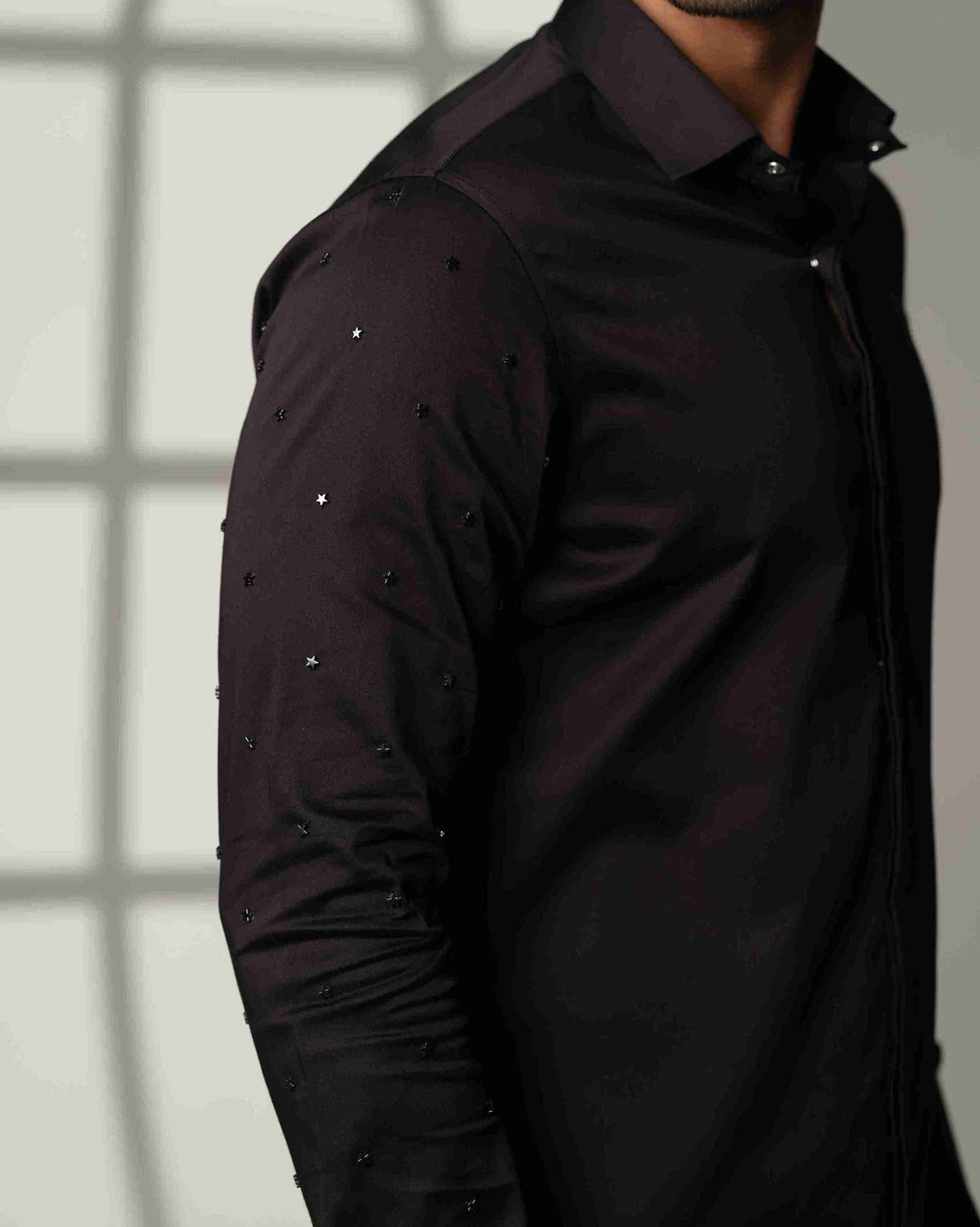 Black Shirt with Artisanal Star Embellishment on Both Sleeves
