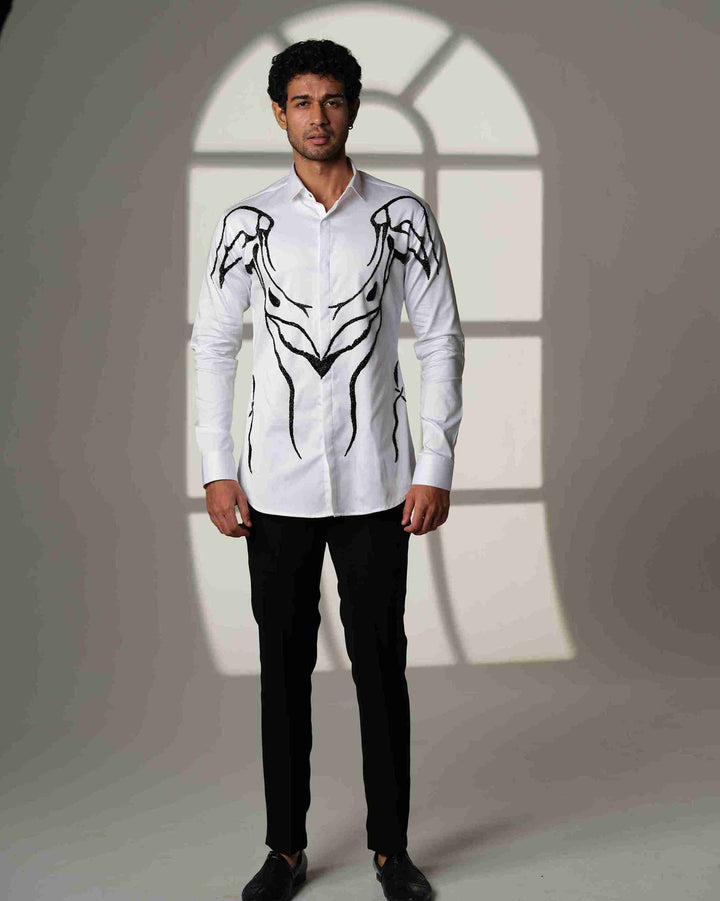 Ivory Armor – White Shirt with Hand-Embroidered Abstract Crest